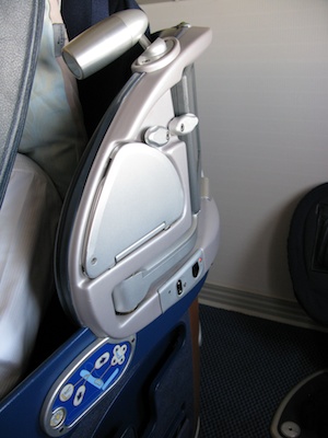 Airplane seat reading light mounted on seat