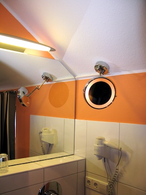 Wall-mounted round lighted mirror