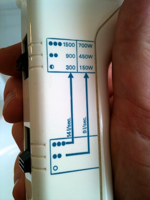 Complex and information-laden labels for the switches on a hair dryer.