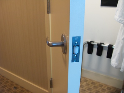 Open closet door with door handle and roller lock