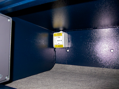 A standard (European) power socket mounted inside the hotel safe