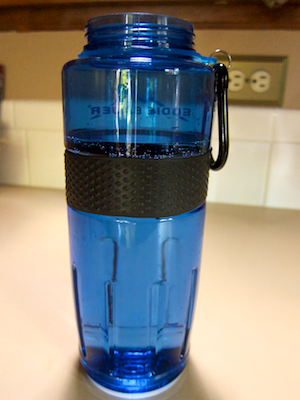 Water bottle filled to just above its rubber anti-slip band