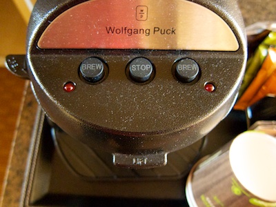 The coffee maker from above with three buttons on the top